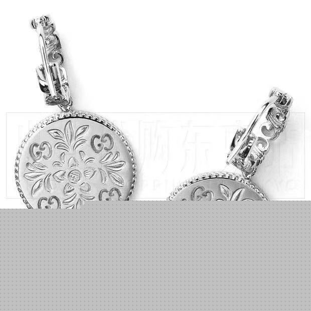 G*u*i earrings